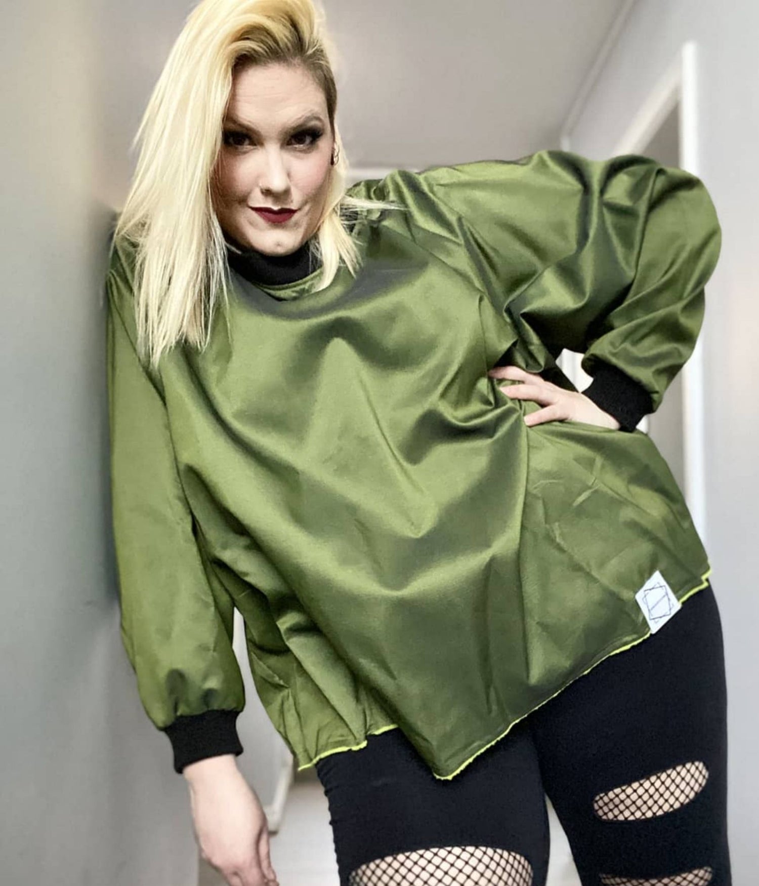 picture of plus size model wearing house of glass olive myself sweater