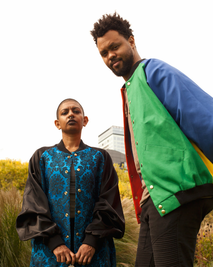 Picture of two models. One is wearing the House of Glass Saint Sabbas Bomber Jacket and the other is wearing the Saint Peter Bomber Jacket