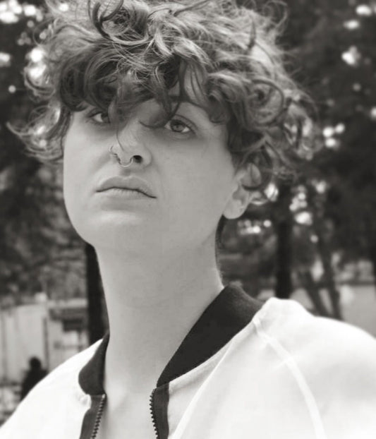 black and white picture of non binary model wearing Sick White Organza Bomber Jacket