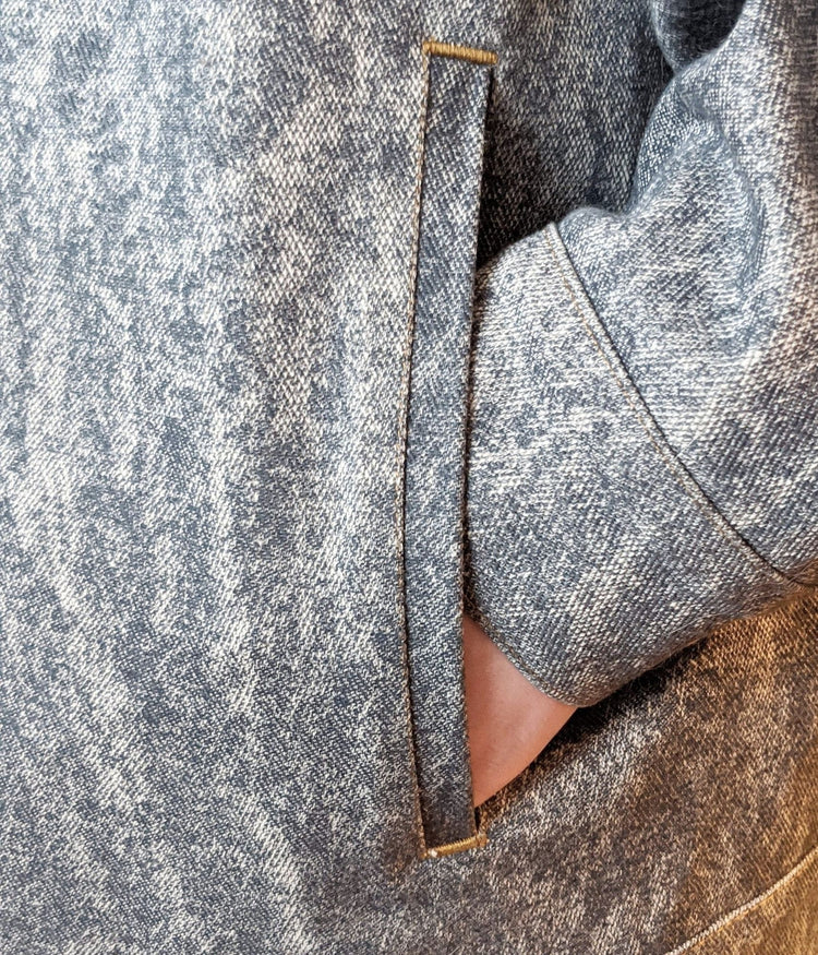 close up picture of cardi b-omber jacket welt pocket detail