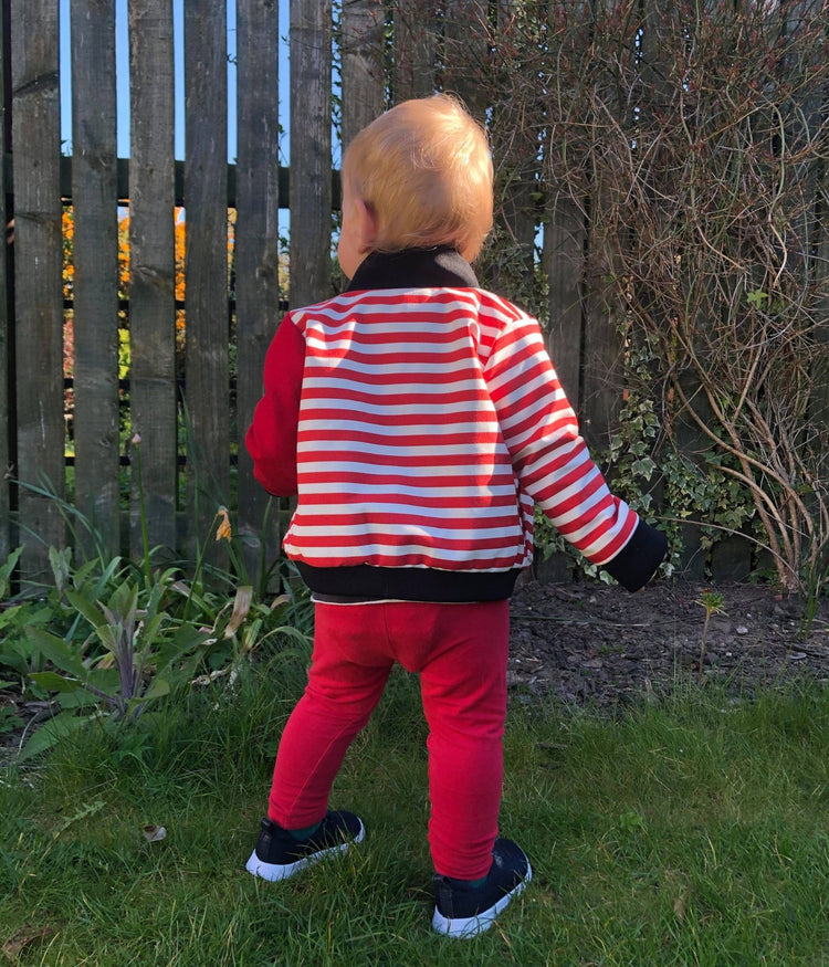 picture of infant male model with his back to the camera wearing Baby Jesus Bomber Jacket