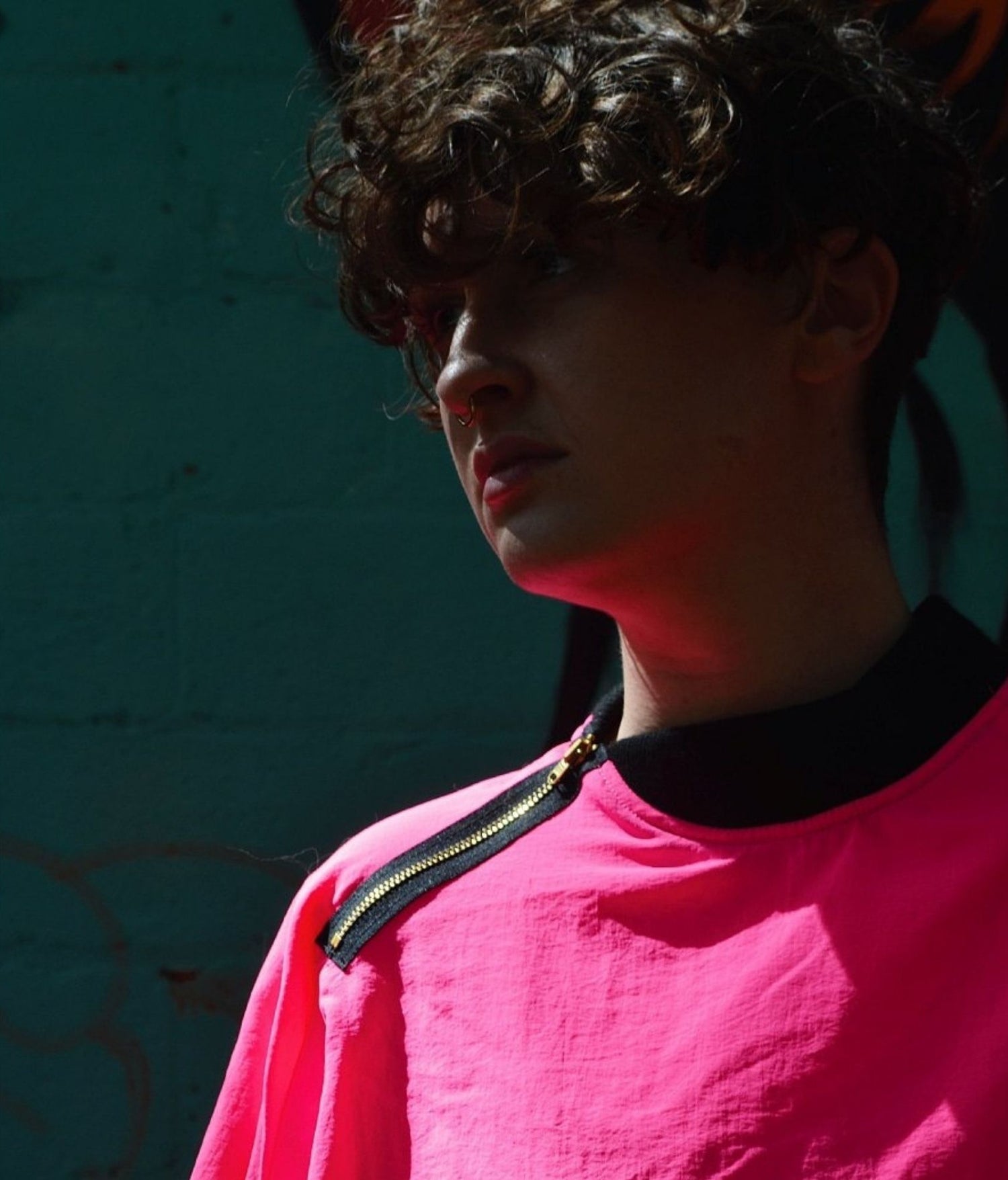 picture of non binary model wearing house of glass neon bad boi jumper