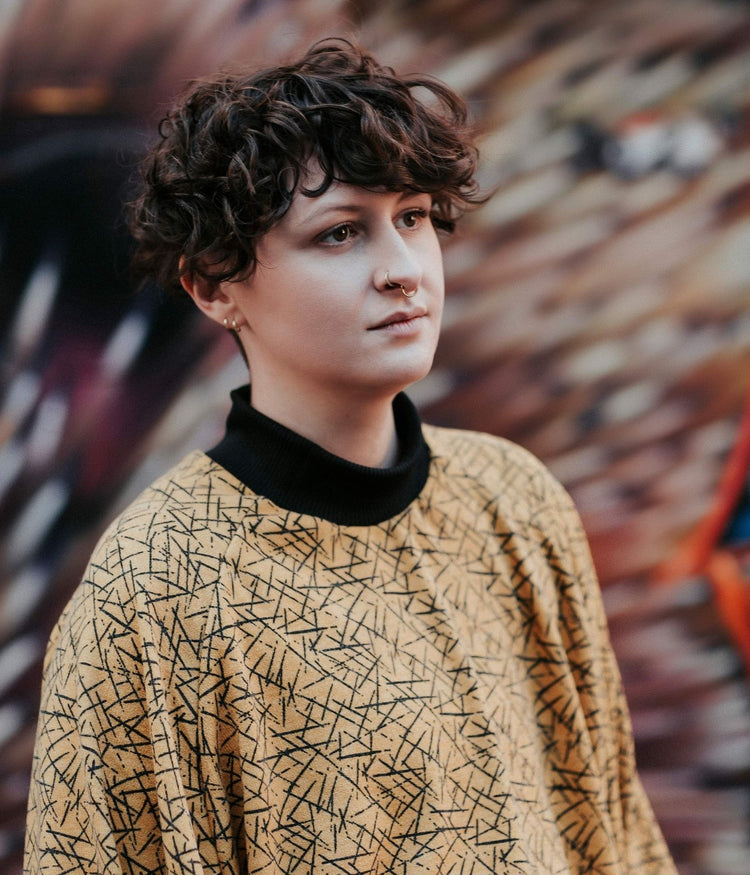 picture of non binary model wearing pickup stix jumper