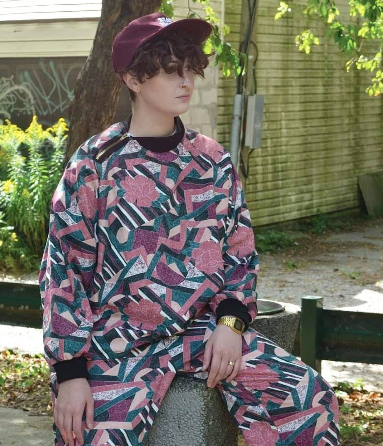 picture of non binary model wearing the St Kevin tracksuit