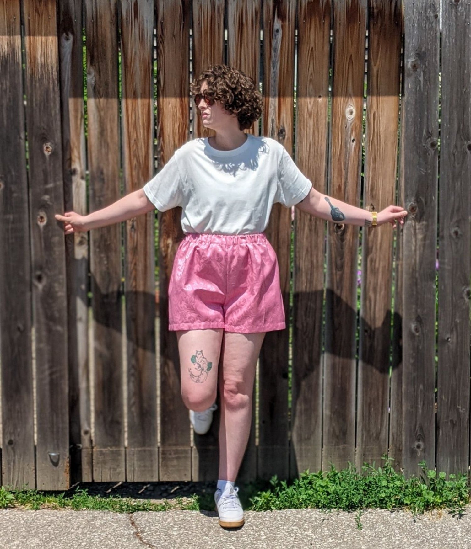 picture of non binary model wearing white t-shirt and Porthos Shorts